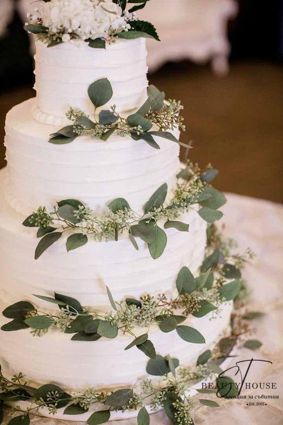 Simple white greenery wedding cake